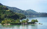 A small island in the bay as the Paul Gauguin nears anchor at the island of Huahine.