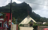 A church and shops in the main town center on Bora Bora.