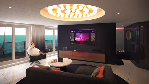 The Posh Suite features a fully stocked bar, record player, spacious living room and a sea terrace.