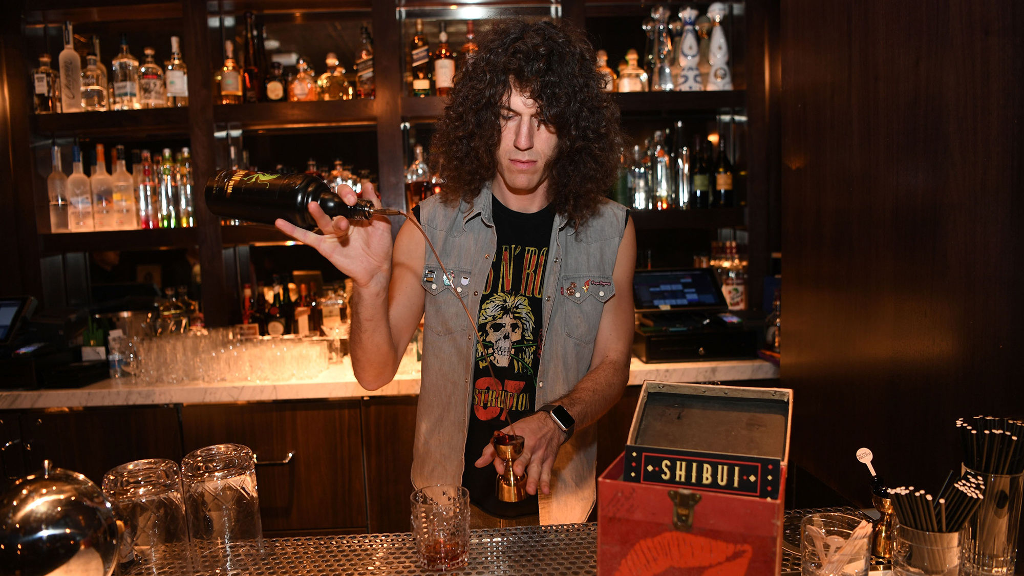 Aaron Polsky of Harvard & Stone in Los Angeles mixes drinks inside the Vinyl Parlor during his bartender residency.