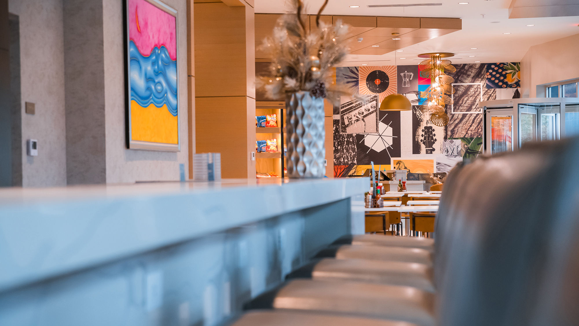 Local art adorns the walls in the Hyatt Place Sandestin's lobby bar and breakfast area.
