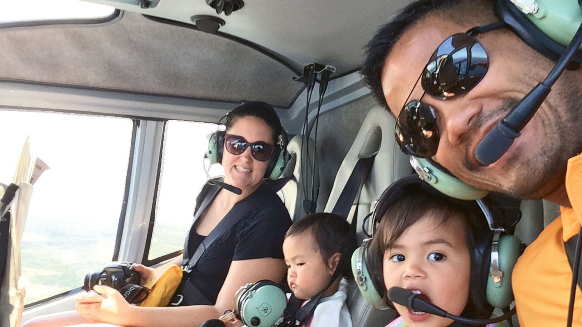 Victor Mayo of Gogo Worldwide Vacations in a helicopter with his family.