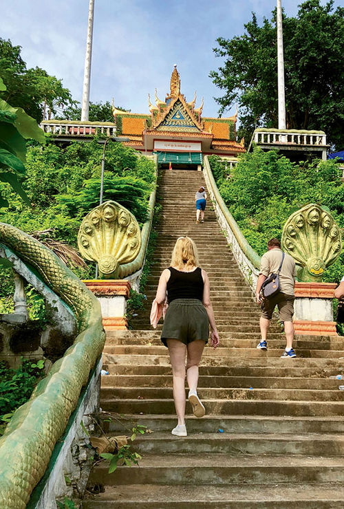 The Wat Hanchey pagoda and monastery awaits at the end of a 330-step climb. The Wat Hanchey pagoda and monastery awaits at the end of a 330-step climb.