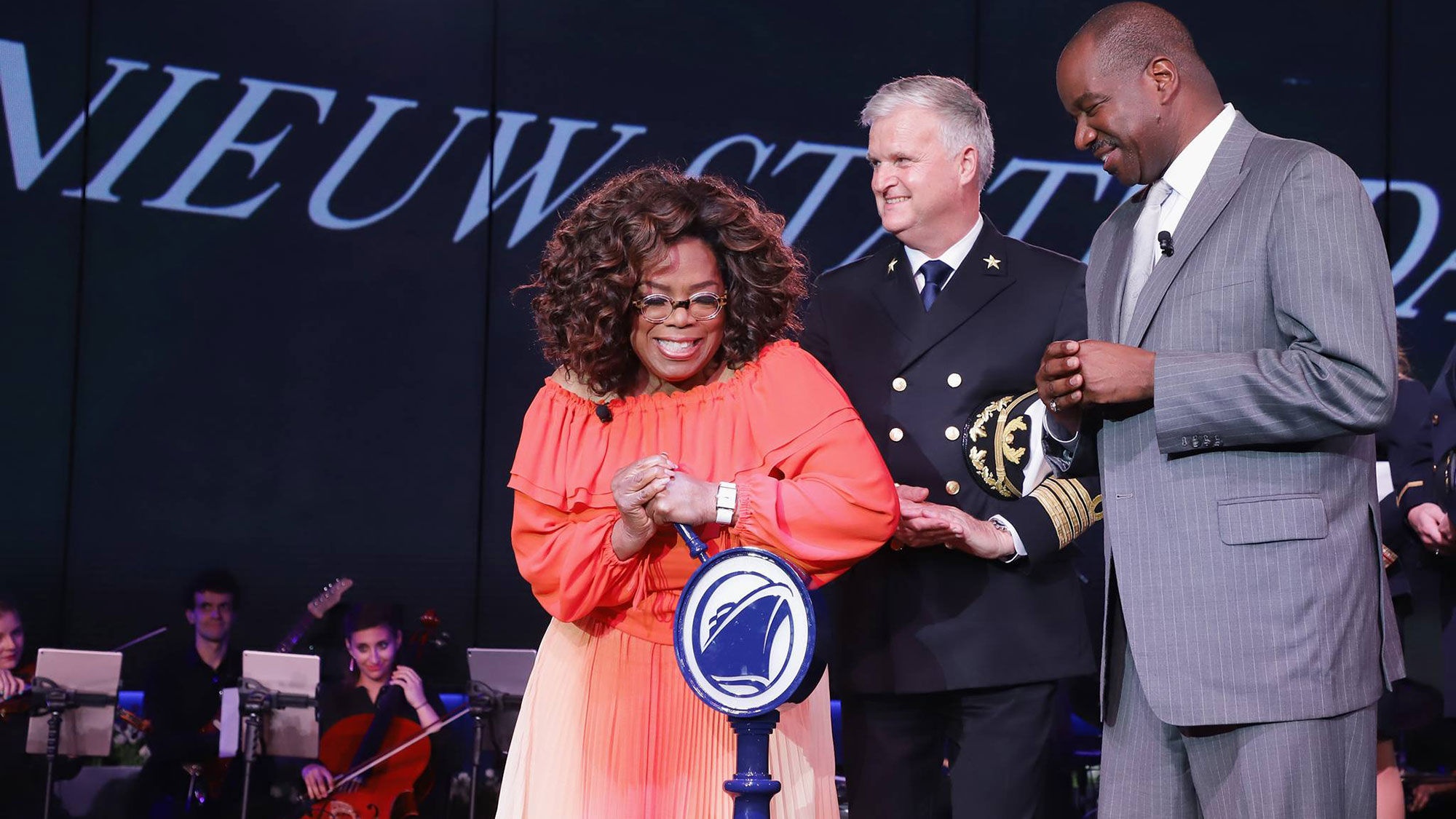 From left, Nieuw Statendam godmother Oprah Winfrey, ship Capt. Sybe de Boer and Holland America Line president Orlando Ashford.