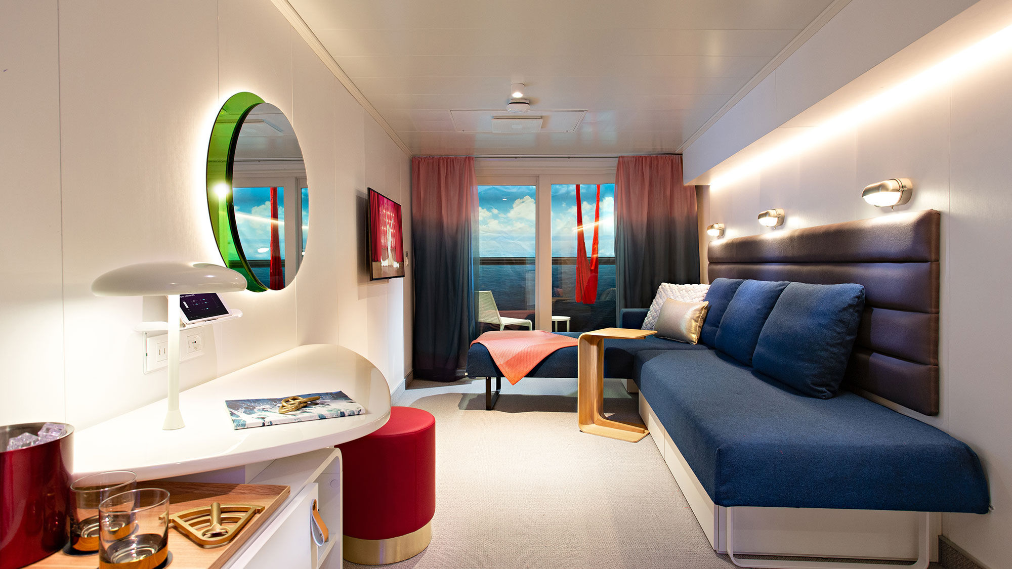 A Virgin Voyages cabin in the daytime, when the Seabed is a lounger.