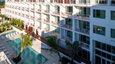 View of the guestroom balconies and pool deck at the Sarasota Modern.