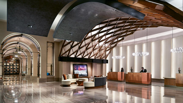The Omni Louisville hotel, which opened last spring, takes many of its design cues from bourbon, including a whiskey barrel-inspired ceiling in the lobby.