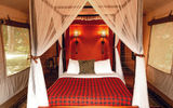At the Fairmont Mara property, on the banks of the Mara River, accommodations are platform tents beautifully decorated with the red plaid design associated with the Masai people.