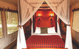 At the Fairmont Mara property, on the banks of the Mara River, accommodations are platform tents beautifully decorated with the red plaid design associated with the Masai people.