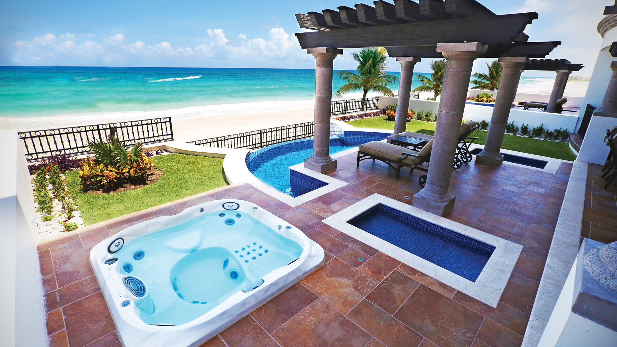 A private terrace at the Grand Residences Riviera Cancun with expansive views of the Caribbean.