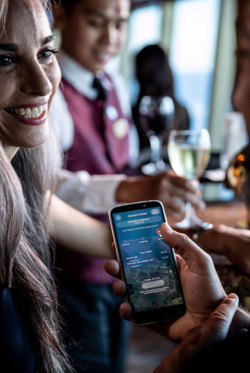 Princess Cruises servers can bring guests food or drink ordered on the Ocean Now app.