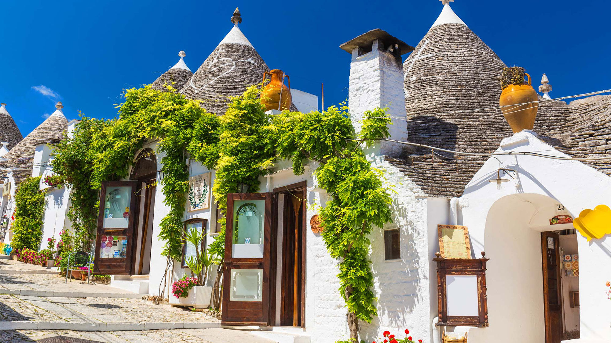 A row of trullo houses in Italy's Puglia region.