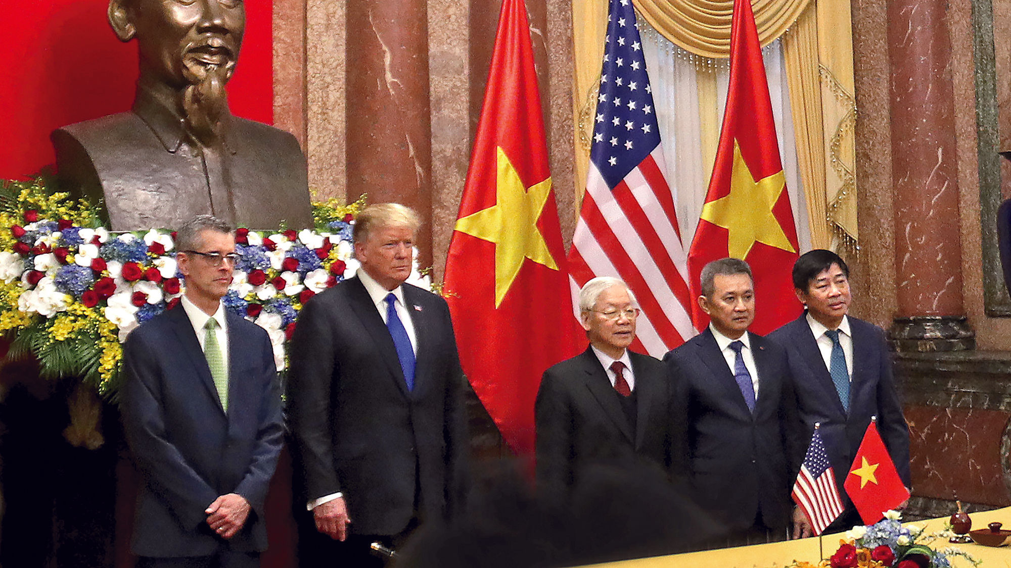 At the Presidential Palace in Hanoi, from left, Sabre Travel Solutions president Dave Shirk, President Donald Trump, Vietnam President Nguyen Phu Trong, Vietnam Airlines CEO Duong Tri Thanh, and Vietnam Airlines CIO Trinh Hong Quang.