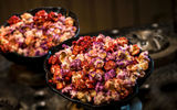 Outpost Mix (colorful sweet and salty popcorn) can be found at Kat Saka's Kettle, located in the Black Spire Outpost market.