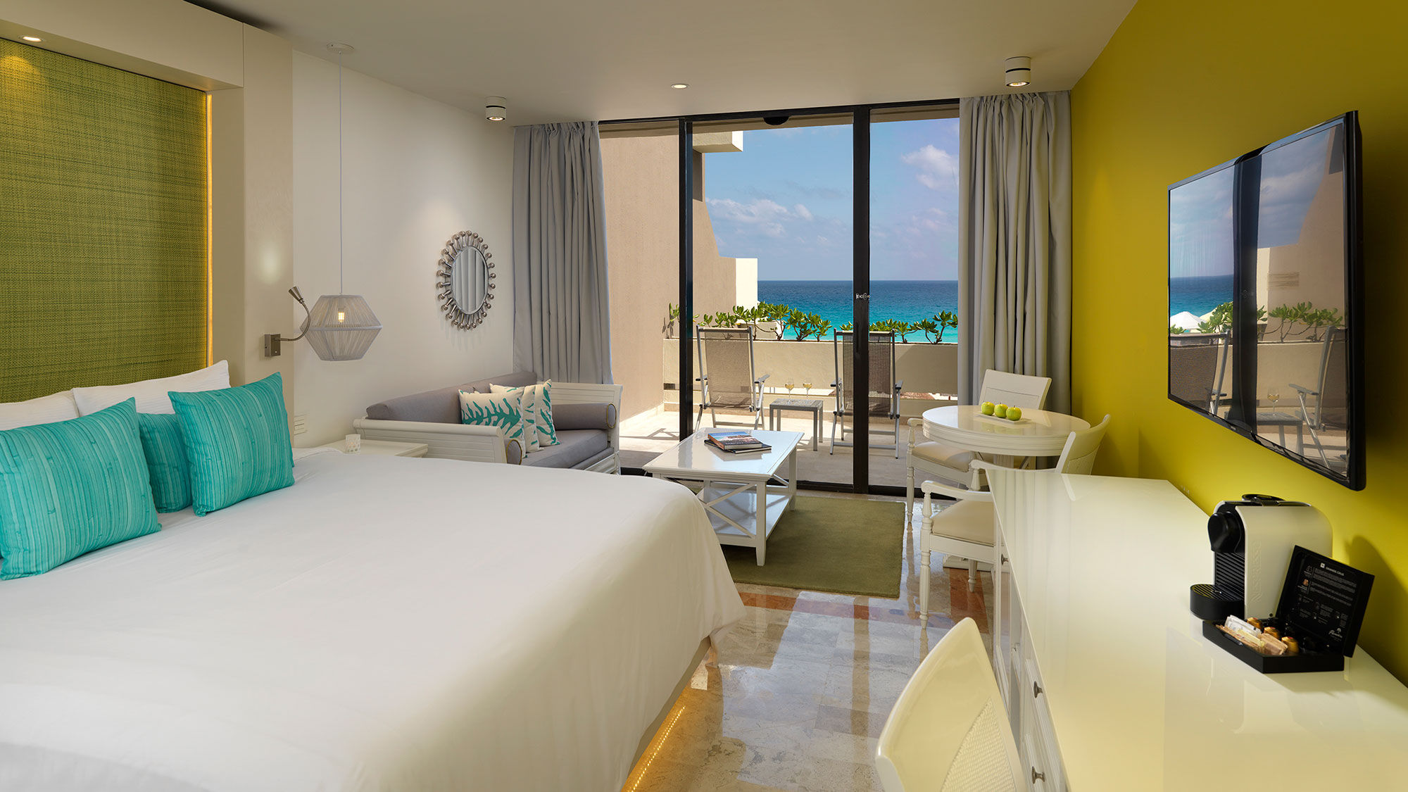 An Ocean View Luxury Junior Suite with king bed at the Paradisus Cancun.
