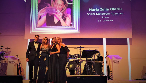 At a black-tie gala, housekeeper Maria Iulia Olariu, second from right, received “rising star” recognition from (left to right) Ben Wirz, managing director global river cruises; CEO Ellen Bettridge; and director of hotel operations, Yoke De Bruyn.