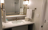 The bathroom sink area in a one-bedroom villa model.