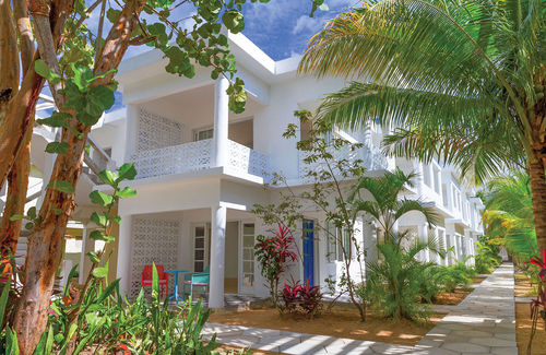 The whitewashed buildings at the Skylark Negril Beach Resort are surrounded by gardens. The Skylark plans to add 17 rooms and a pool this year.