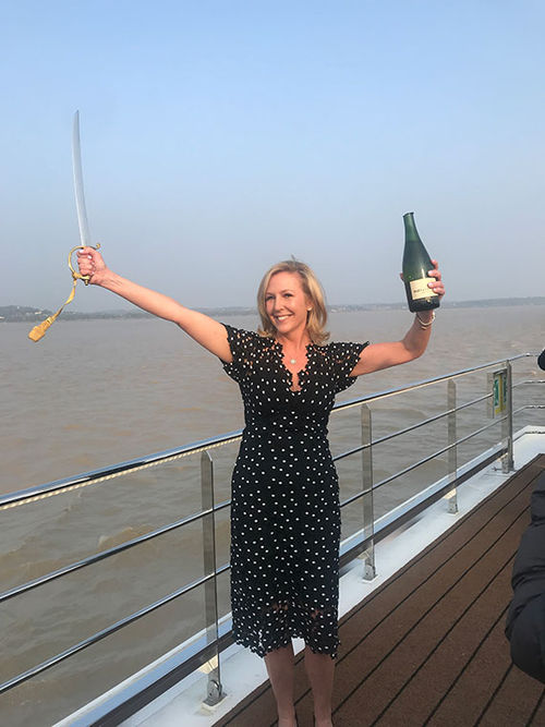 CEO Ellen Bettridge sheared the top of a champagne bottle with a sword in a ceremony to welcome the reborn S.S. Bon Voyage. CEO Ellen Bettridge sheared the top of a champagne bottle with a sword in a ceremony to welcome the reborn S.S. Bon Voyage.