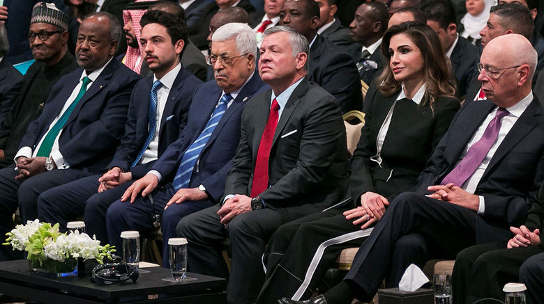 President Muhammadu Buhari of Nigeria, President Ismail Omar Guelleh of Djibouti, Crown Prince Hussein bin Abdullah of Jordan, President Mahmoud Abbas of the Palestinian Authority, King Abdullah II of Jordan, Queen Rania of Jordan and Klaus Schwab, executive chairman of the World Economic Forum, listen to presentations about tourism in Jordan at a regional WEF conference on the Middle East and Africa in early April 2019.