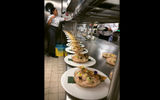 Dishes being staged in the galley of the Celebrity Flora which will serve local Ecuadoran cuisine and classic items in the Seaside Dining Room.