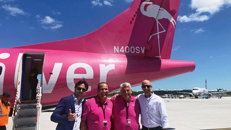 ATR and Silver Airways executives pose in front of the airline's first ATR jet.