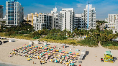 Multicolored umbrellas mark the Confidante Miami Beach's exclusive spot on the sand.