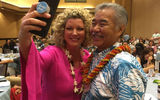 Jenn Lee, vice president of Travel Planners International, grabs a selfie with Hawaii Gov. David Ige. Both were speakers at the 2019 Travel Weekly Hawaii Leadership Forum.