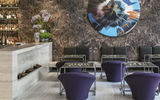 The lobby of the Jaffa, a Luxury Collection Hotel, features a Damien Hirst painting and backgammon tables.