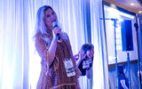 Rachel Morrell of Creation Vacation entertains the crowd at Karaoke Night, sponsored by Playa Hotels & Resorts.