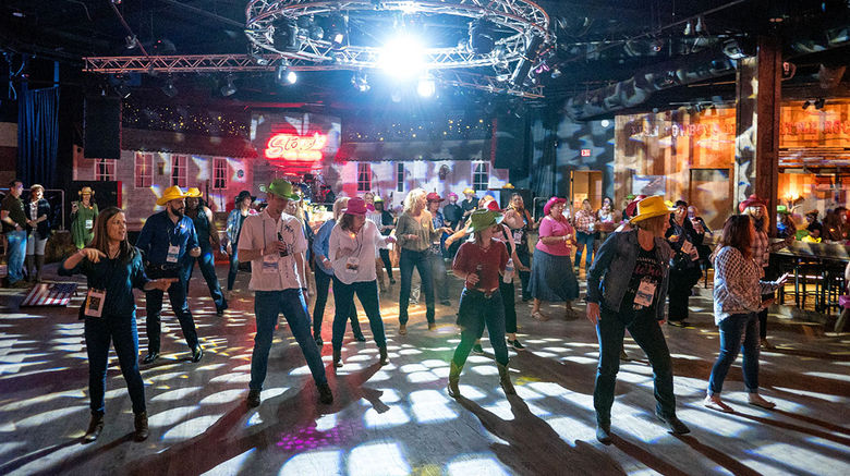 Attendees at Travel Weekly's sixth annual GTM West conference learn to line dance at a reception held at Stoney's in Las Vegas and sponsored by the Las Vegas Convention and Visitors Association.