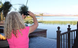 Alison Crummy of Failte Ireland snaps a photo of the views over Lake Las Vegas at the closing reception.