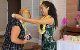 Samarah Meil of Amarillo Travel Network and an GTM advisory board member, left, receives a lei before the Hawaiian Islands Aloha Breakfast.