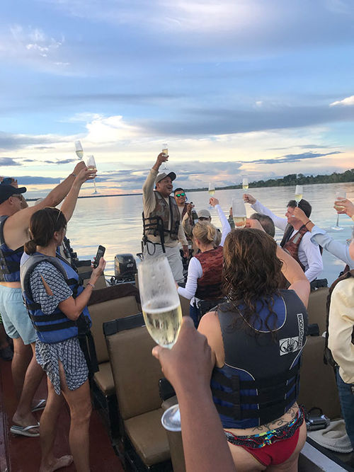 Guests on the Zafiro enjoying sundowners after a kayaking and swimming excursion trip on the final day of four-day cruise on the Peruvian Amazon. Guests on the Zafiro enjoying sundowners after a kayaking and swimming excursion trip on the final day of four-day cruise on the Peruvian Amazon.