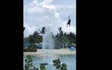 The last leg of a three-stage zipline on CocoCay runs through a fountain.