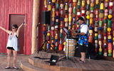 A performer and guest at the performance stage at Captain Jack's.