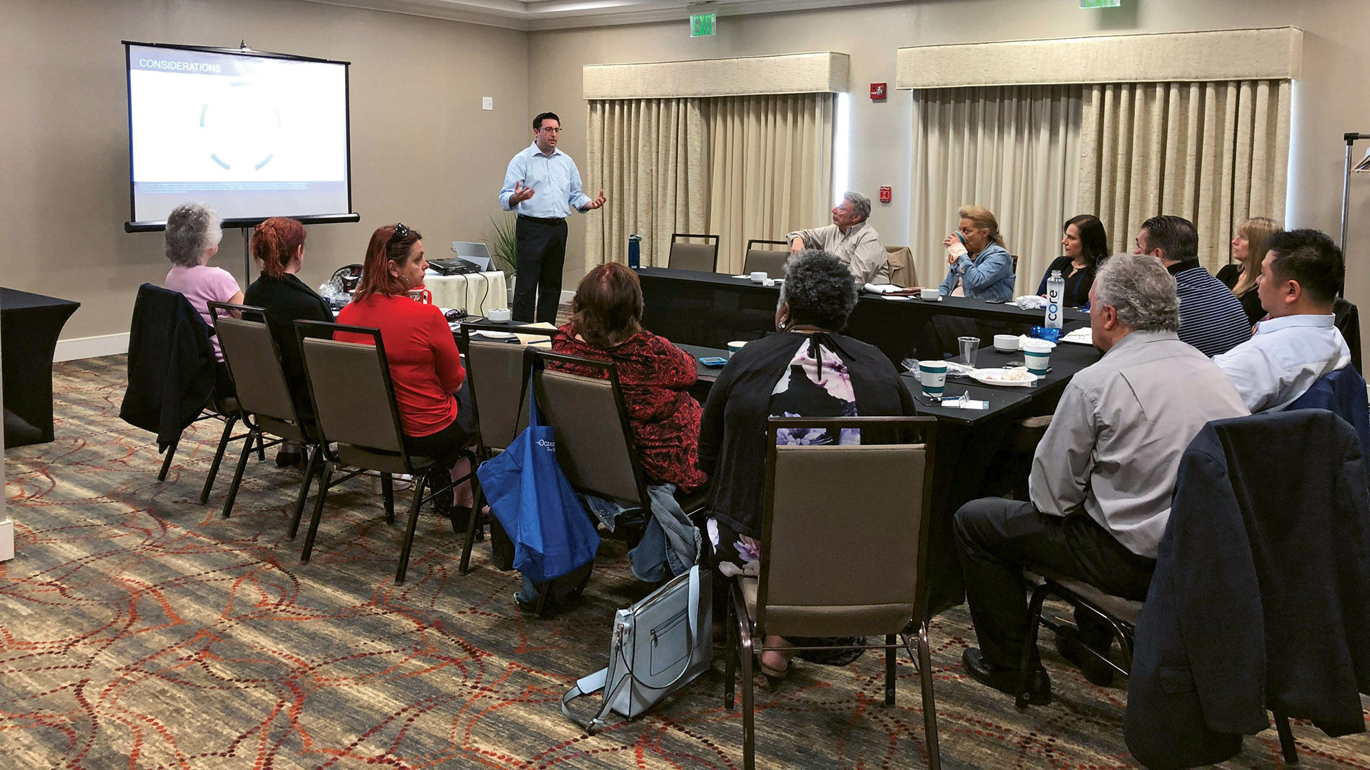Isaac Cymrot, vice president of industry relations at Travel Insured International, leads an agent training event on Long Island.
