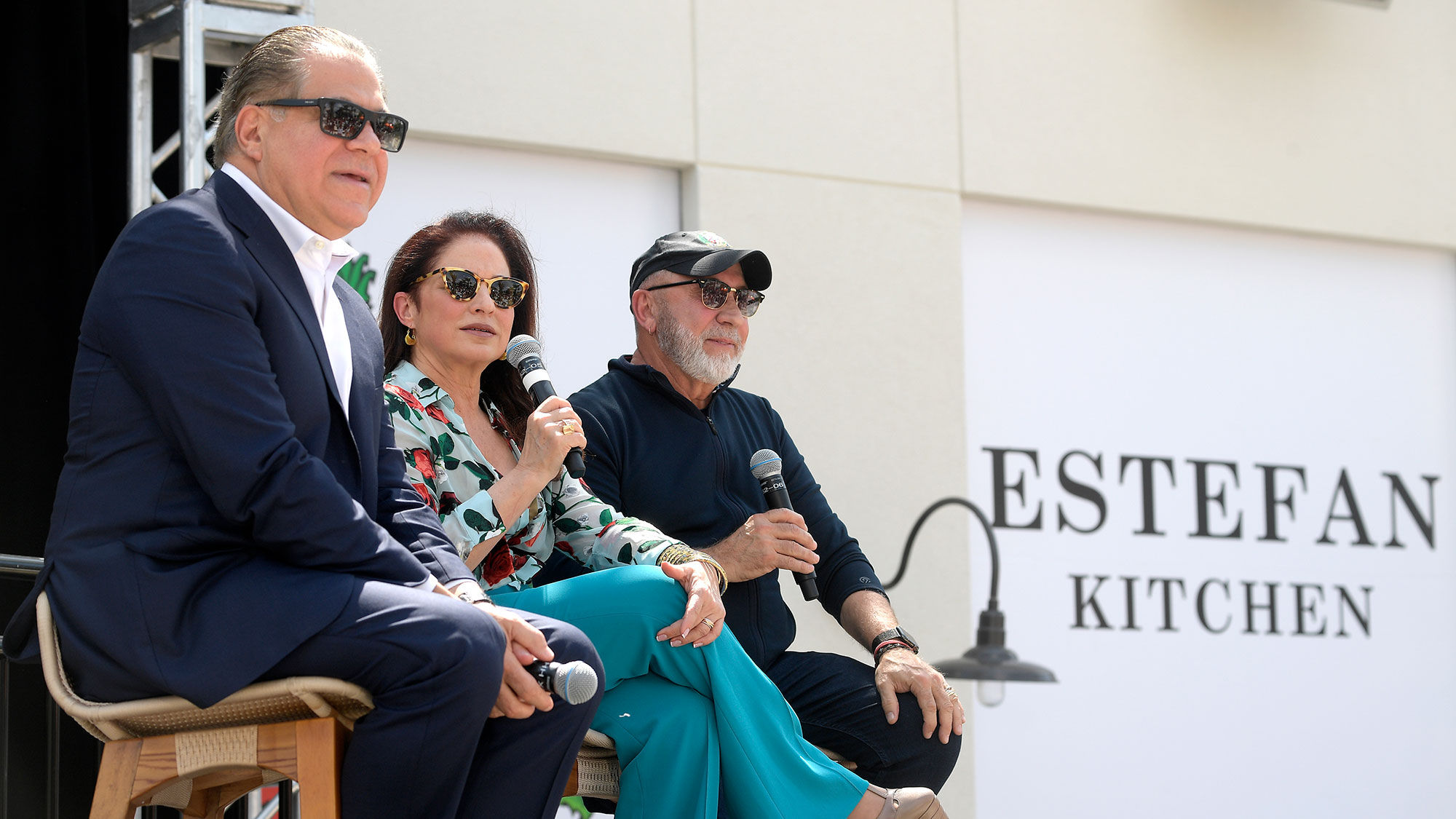 Margaritaville Orlando's developer, Art Falcone, at left, joins Gloria and Emilio Estefan to announce the addition of Estefan Kitchen to the Sunset Walk complex.