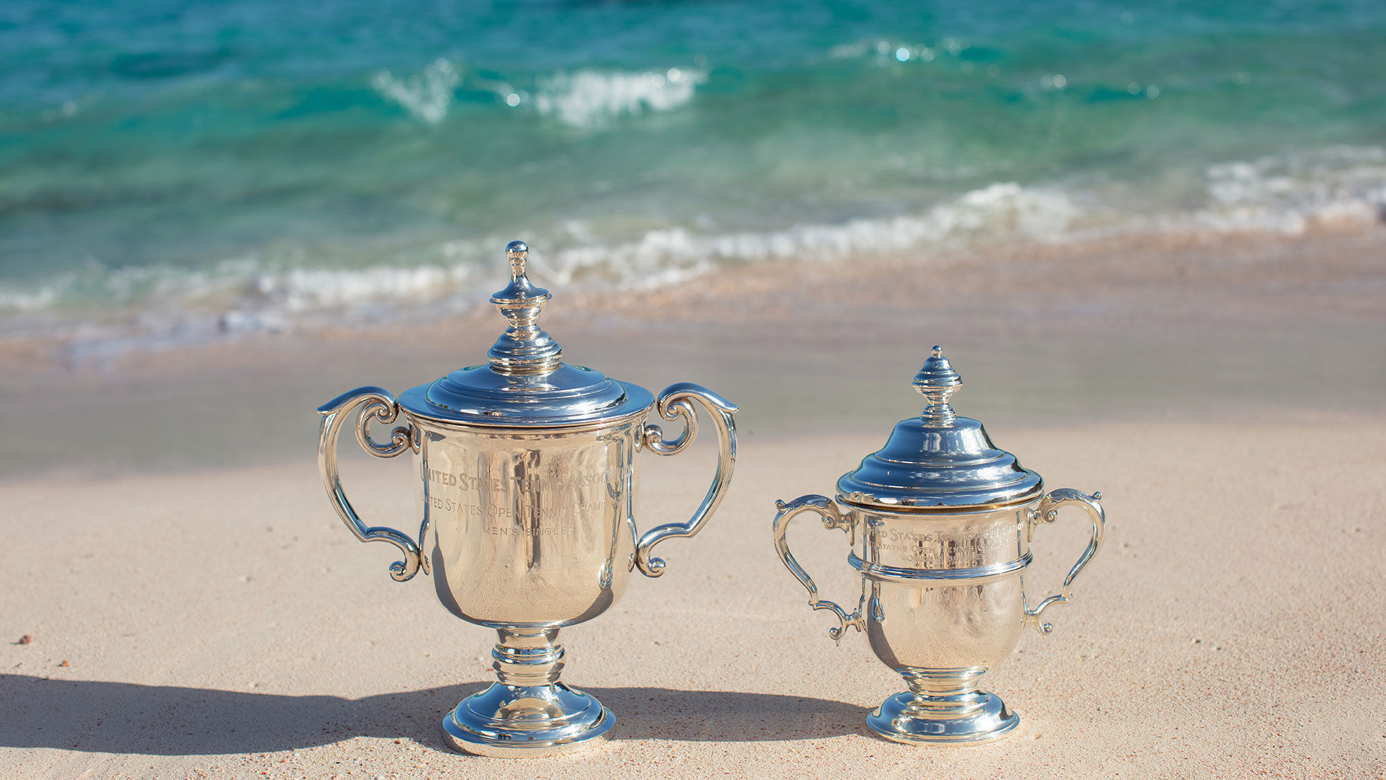 U.S. Open tennis trophies on the beach in Bermuda. A partnership has been formed between Bermuda and the U.S. Tennis Association.