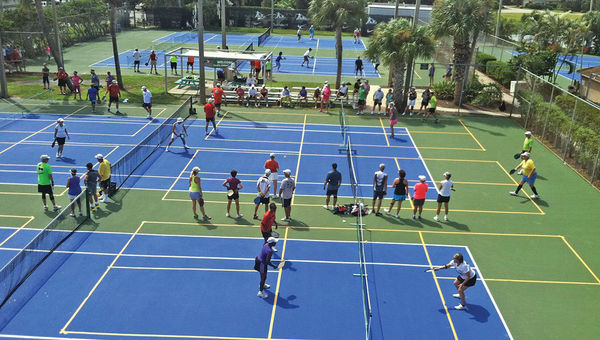 Club Med’s tennis courts can be converted for pickleball to accommodate group bookings. A recent group at Club Med Sandpiper Bay making use of 20 pickleball courts.