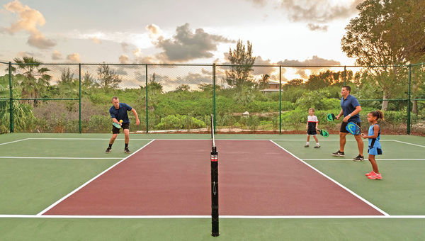 The Ritz-Carlton, Grand Cayman promotes pickleball as a family-friendly activity. The Ritz-Carlton, Grand Cayman promotes pickleball as a family-friendly activity.