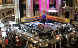 The showpiece of many a cruise ship, the Carnival Sunrise's lobby bar, where guests gathered before the cruise and a DJ spun dance music.
