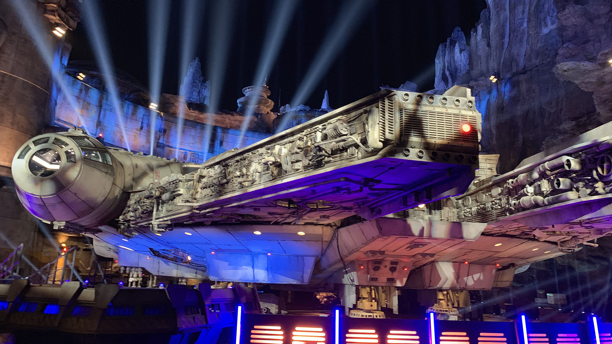 The Millennium Falcon in Star Wars: Galaxy's Edge at night.