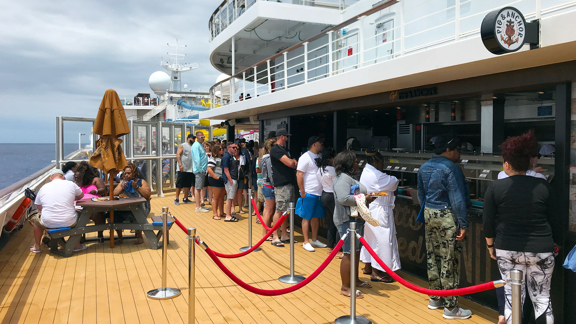 The line for the Pig & Anchor Smokehouse, the Carnival Sunrise' barbecue restaurant.