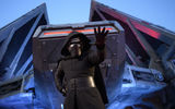 Kylo Ren stands guard near the Millennium Falcon.