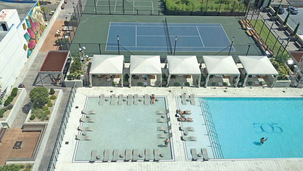 The pool deck at the complex, which also offers a tennis court, pickleball court, putting green and dog run. The pool deck at the complex, which also offers a tennis court, pickleball court, putting green and dog run.