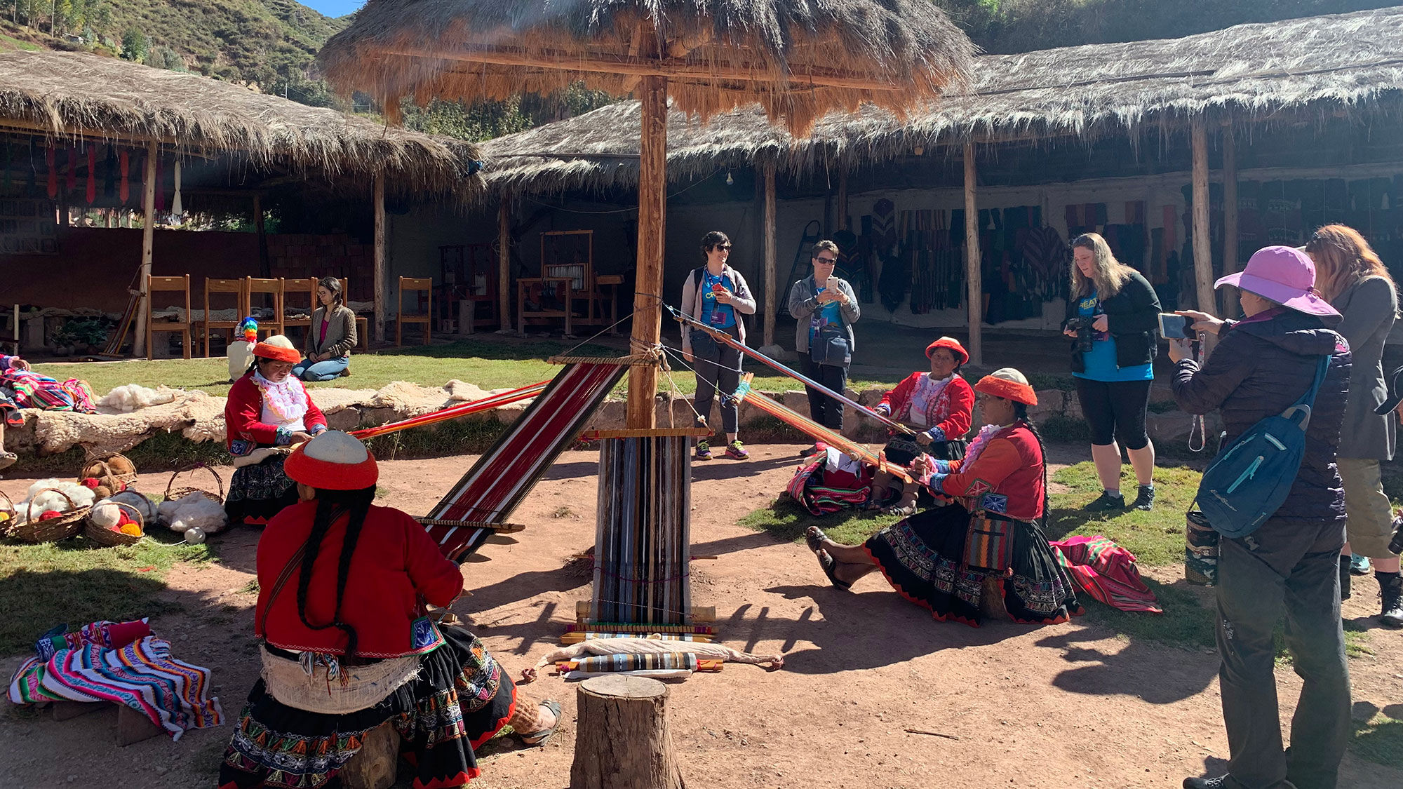 Women from the village of Ccaccaccollo in Peru demonstrate traditional textile creation and weaving to visitors as part of a community development and cultural preservation programs funded by G Adventures and nonprofit, Planeterra Foundation.