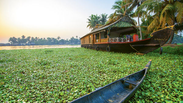 A kettuvallam, or houseboat, cruises the backwaters of Kerala. A kettuvallam, or houseboat, cruises the backwaters of Kerala.