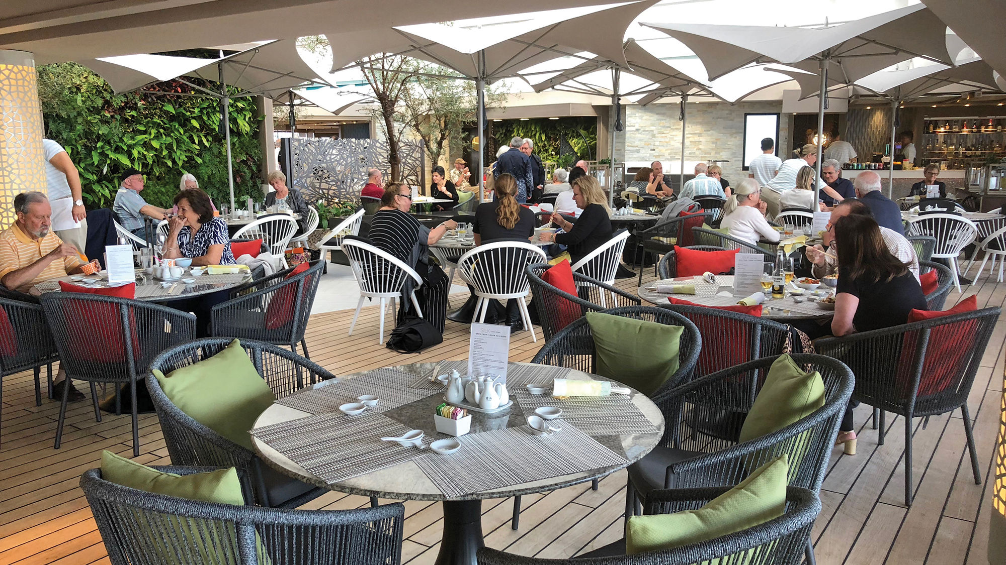 On the Crystal Serenity, the second pool was converted to dining space, with living walls providing pops of greenery.