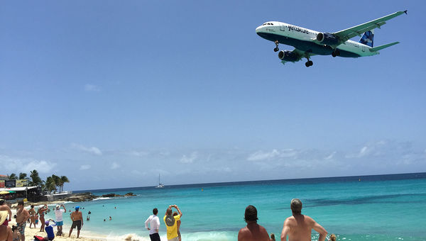 Plane landings at Princess Juliana Aiport come in low over Maho Beach.